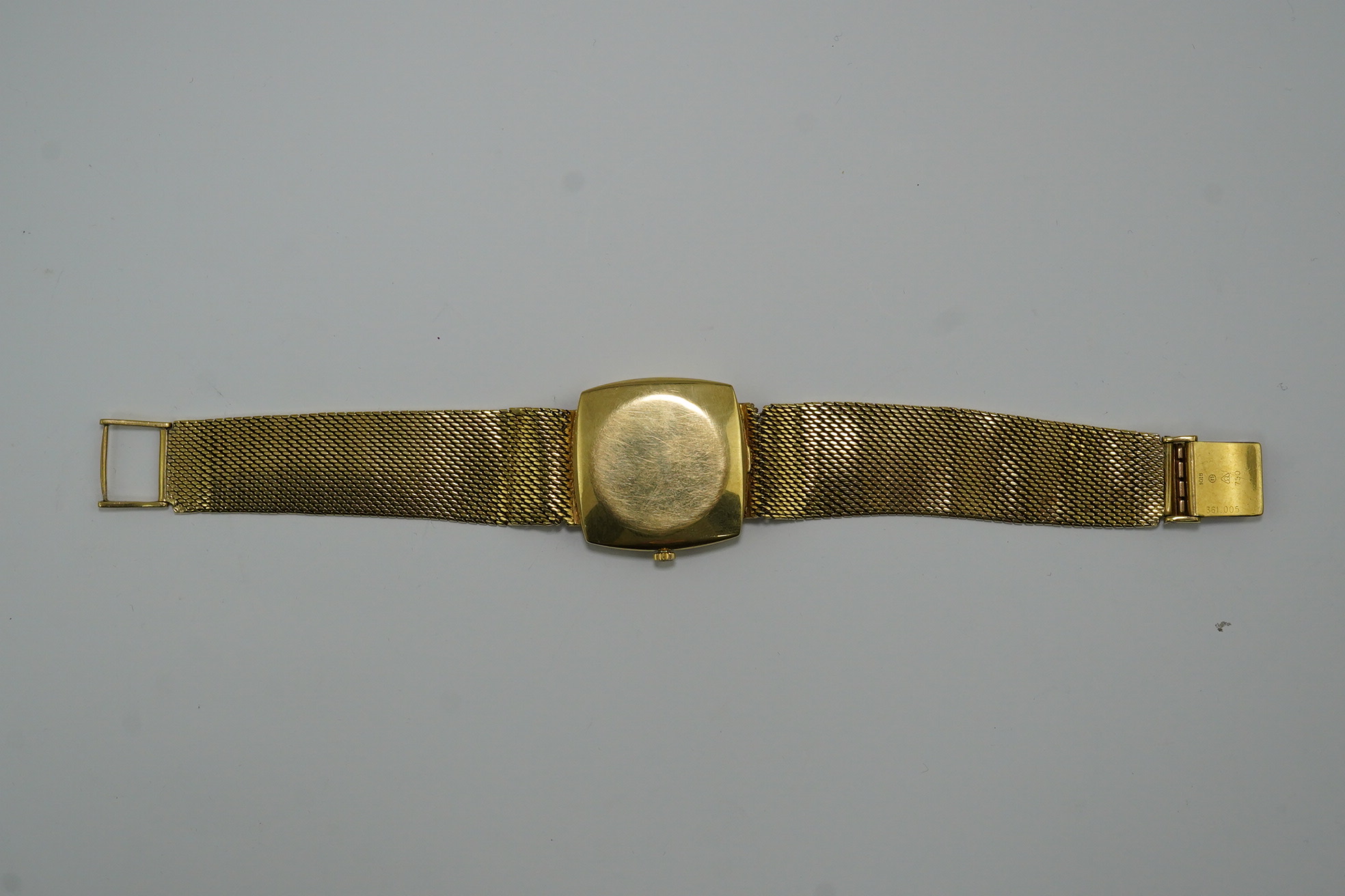 A gentleman's early 1960's 18ct gold Omega De Ville automatic dress wrist watch, on integral Omega 18ct gold mesh link bracelet